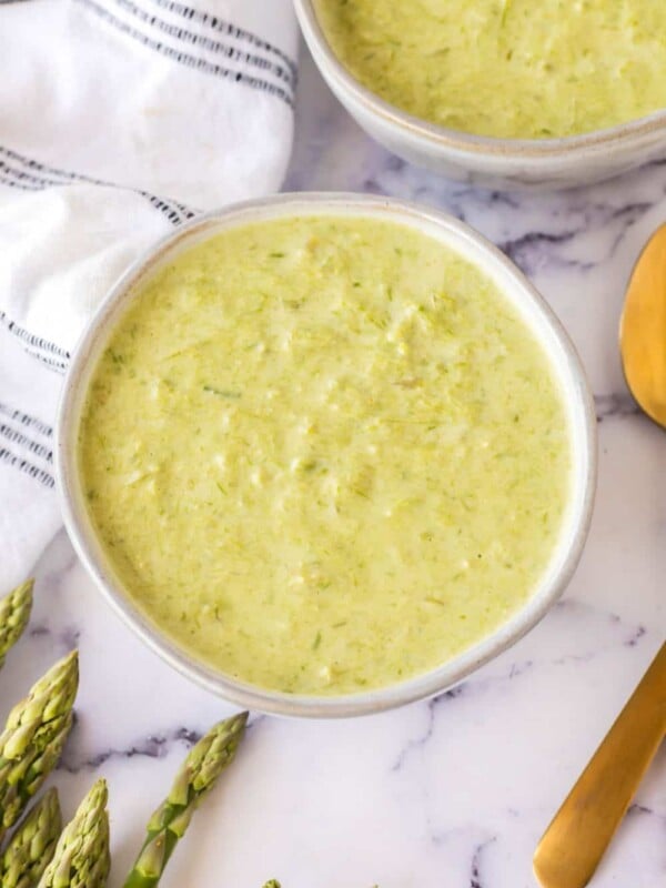 top view aesthetic photo of two bowls of asparagus soup