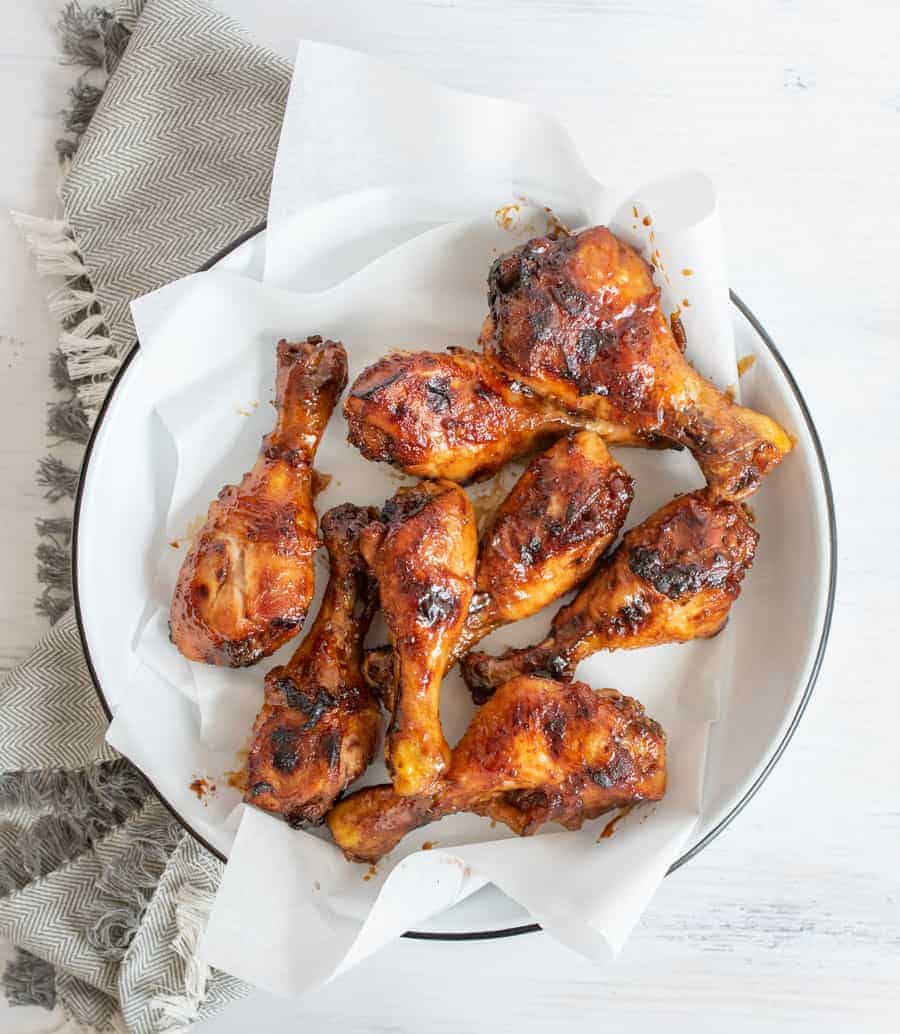 plate of chicken legs on a gray towel.